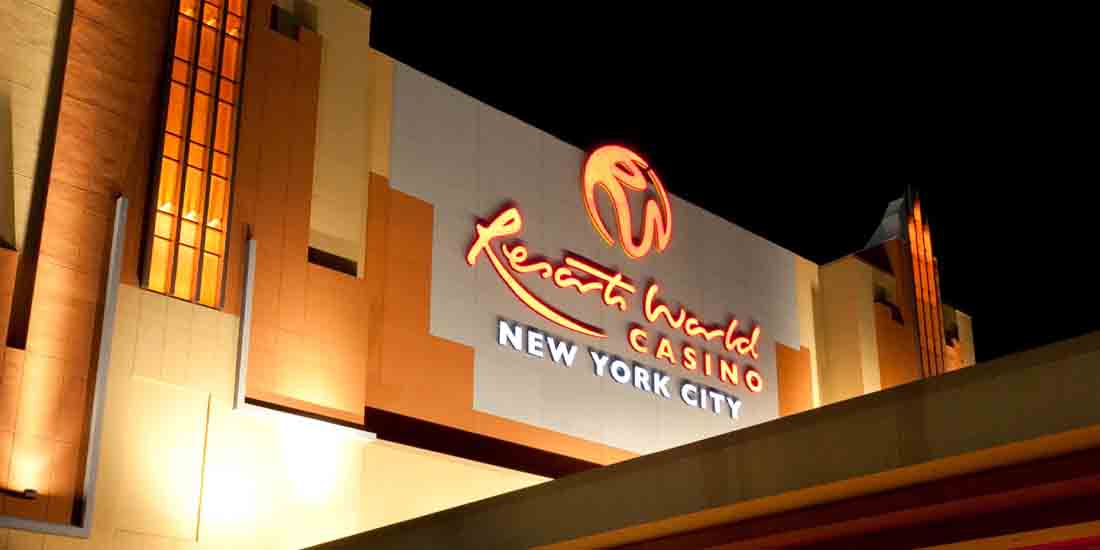 Nighttime exterior of a casino with a neon red cursive sign and 'New York City' below.